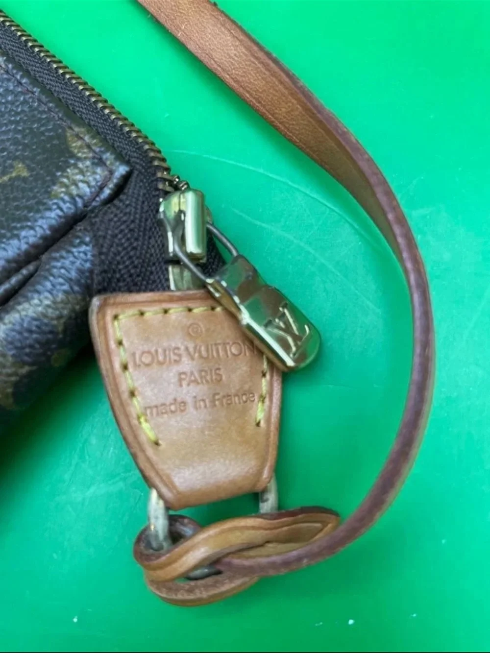 Louis Vuitton Monogram Mini Pochette in Brown